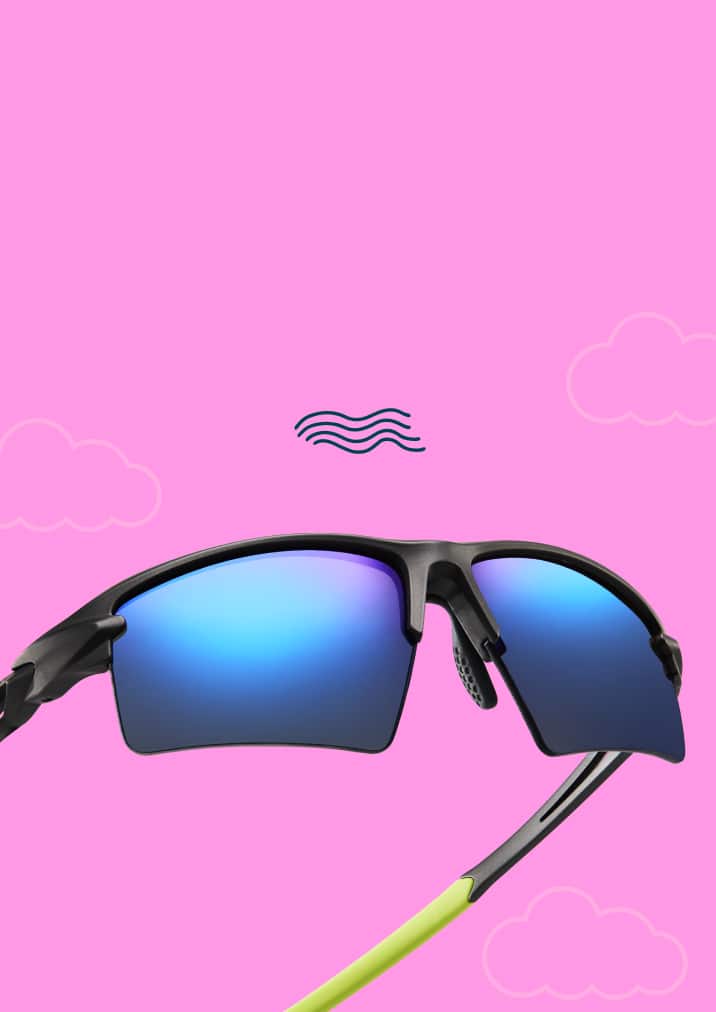 Close-up view of lightweight Zunnies running sunglasses with back frames and blue lenses on a hot pink background.