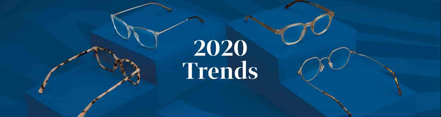 Trending glasses for 2020 on a classic blue background, including clear square glasses #7818716, tortoiseshell square glasses #4427835, neutral round glasses #4431033, and vintage metal geometric glasses #157714.