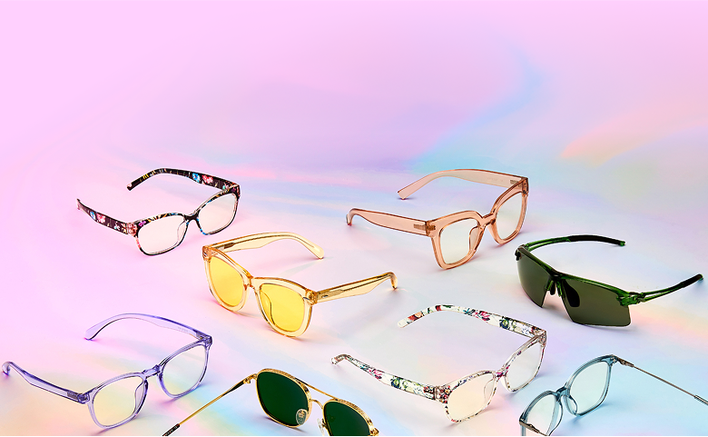 A collection of eyeglasses and sunglasses on a pastel gradient background.