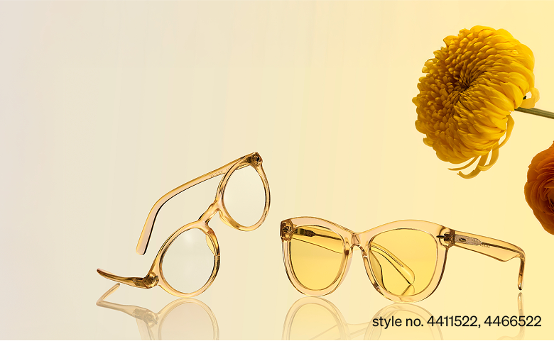 Two translucent yellow glasses style no. 4411522, 4466522 set on a gradient background with yellow flowers.