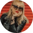 Nicole Sereda wearing Zenni black oversized square sunglasses.