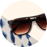 Zenni premium square sunglasses #113125 on a cream-colored background with blue tie-dye accents.