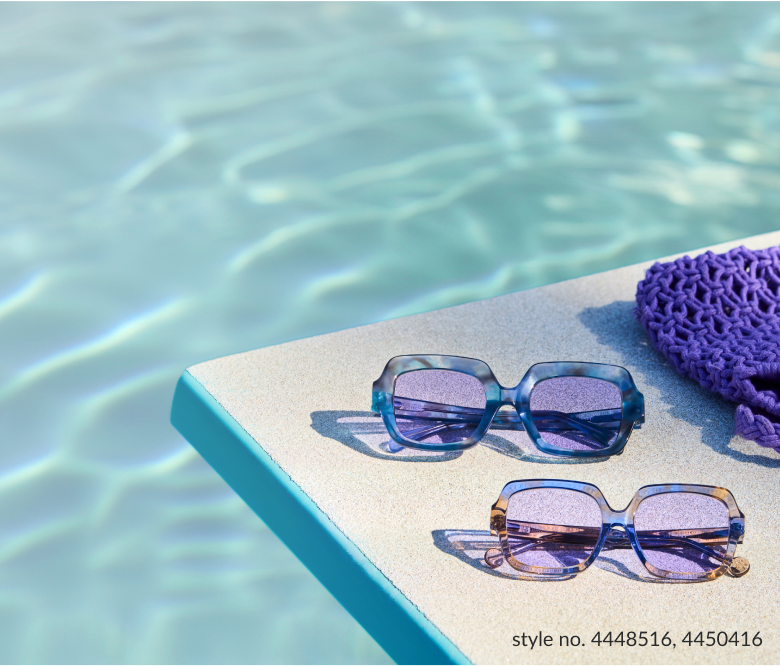 2 pairs of translucent sunglasses with light sunglasses tints on beach towel by the pool.