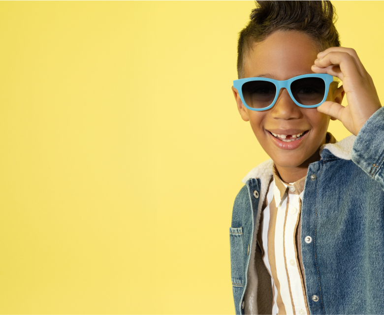 African teenage boy wearing sunglasses - Stock Photo - Dissolve