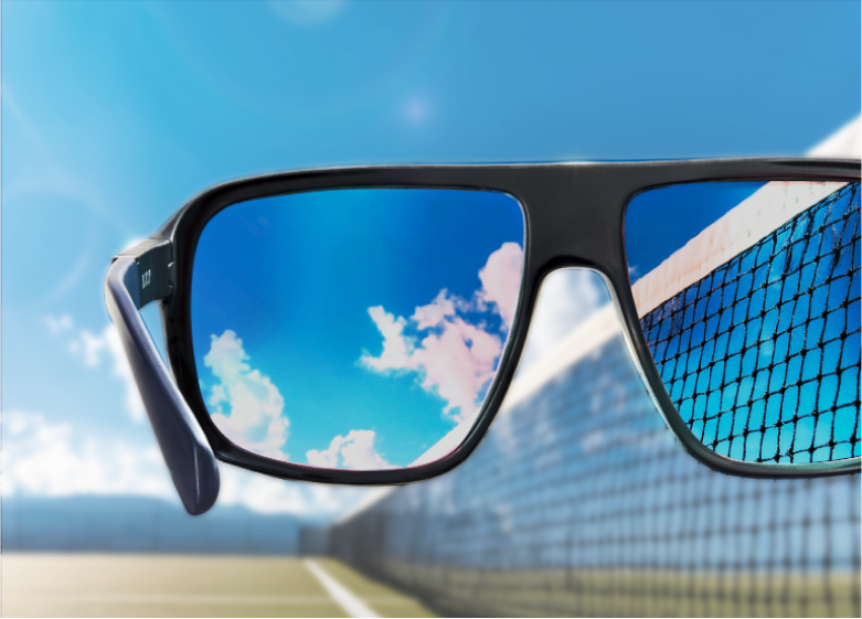 Point of view of looking through polarized sunglasses at a tennis court.