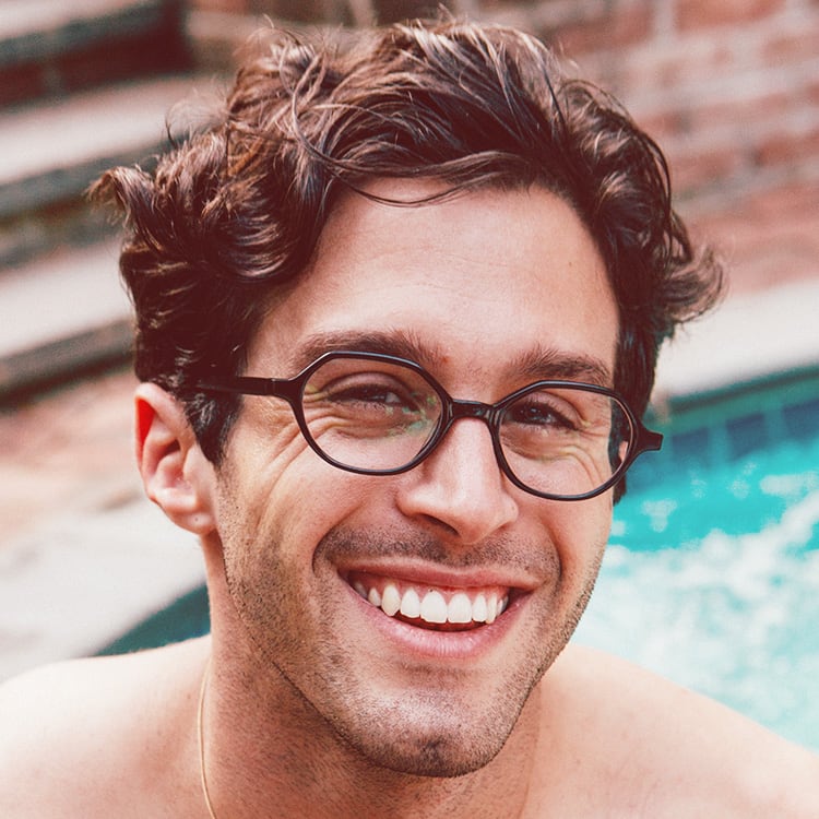 A man enjoying the pool with zenni glasses