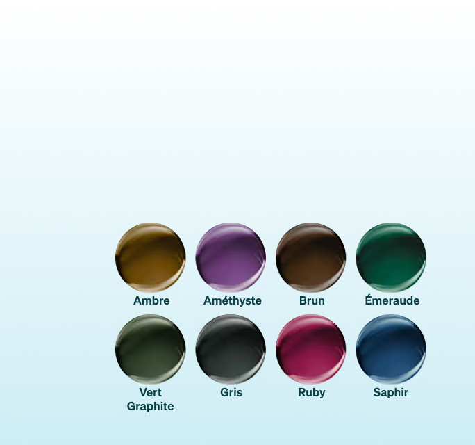 Une grille de huit échantillons de lentilles circulaires présentant les différentes couleurs Transitions® Gen S™, notamment ambre, améthyste, brun, émeraude, vert graphite, gris, rubis et saphir.