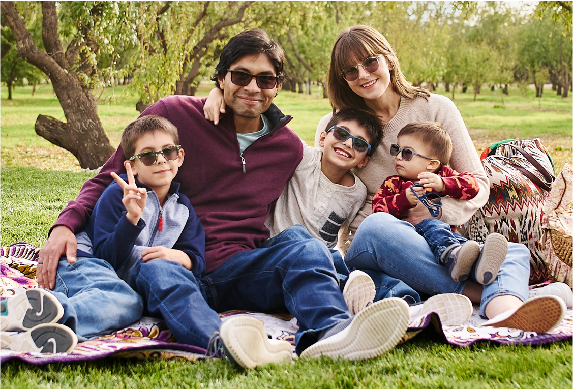 Image of a family wearing Zenni sunglasses outside in the sun.