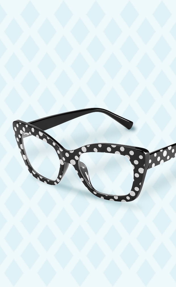 A pair of black cat-eye glasses with a white polka-dot pattern floating against a light blue background with a white diamond trellis design.