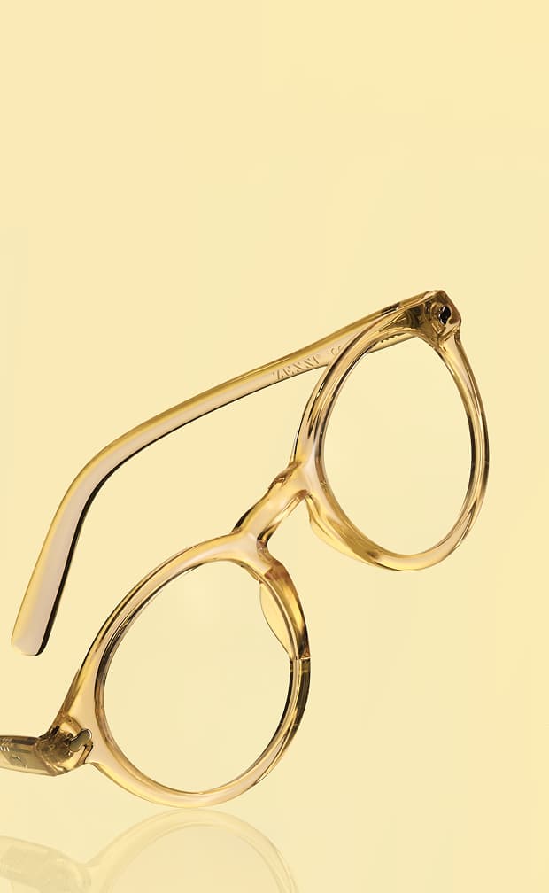 Yellow-tinted Zenni translucent glasses with orange flowers on a golden background.