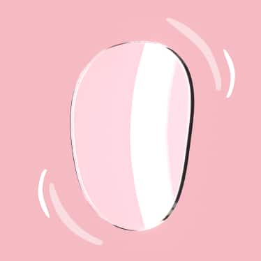 A clear Trivex lens on a pink background, turned slightly to profile, with illustrated curved lines around it to indicate its lightweight.