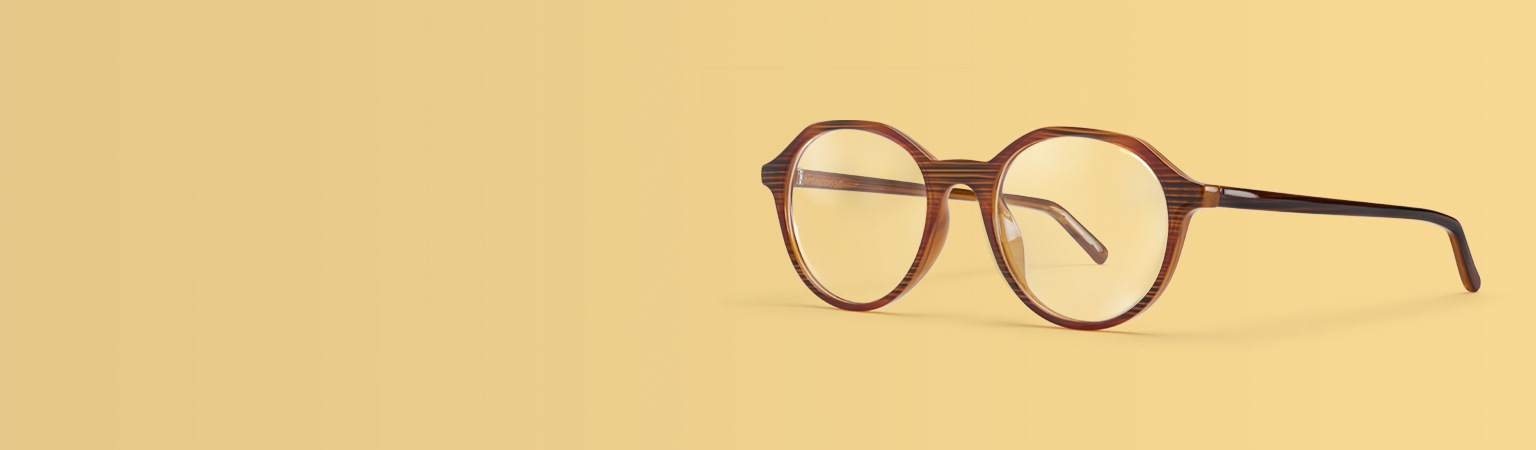 Image of Zenni brown round glasses #2030715 on a yellow background.