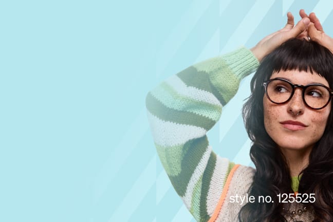 Woman in glasses style no. 125525 wearing a striped sweater against a light blue background.