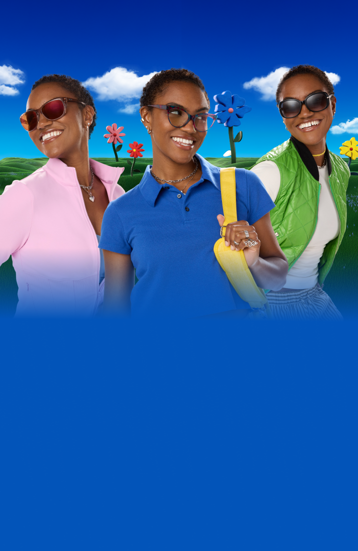 Banner featuring three women, each smiling and wearing a different style of glasses (sunglasses, prescription, and large square frames), posed in a rolling green field with oversized cartoon flowers under a blue sky.