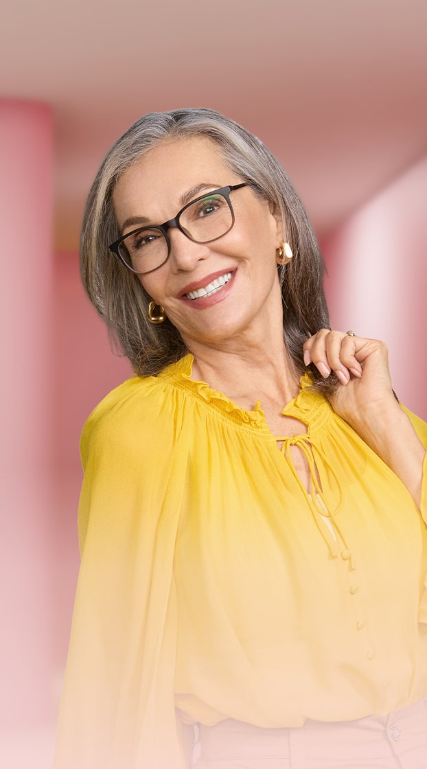 Woman wearing Zenni square glasses in a styled indoor setting, highlighting progressive lenses for near and far vision