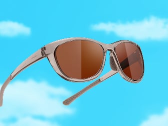 Zenni sunglasses in yellow aviator frames with green mirrored lenses against a blue sky background