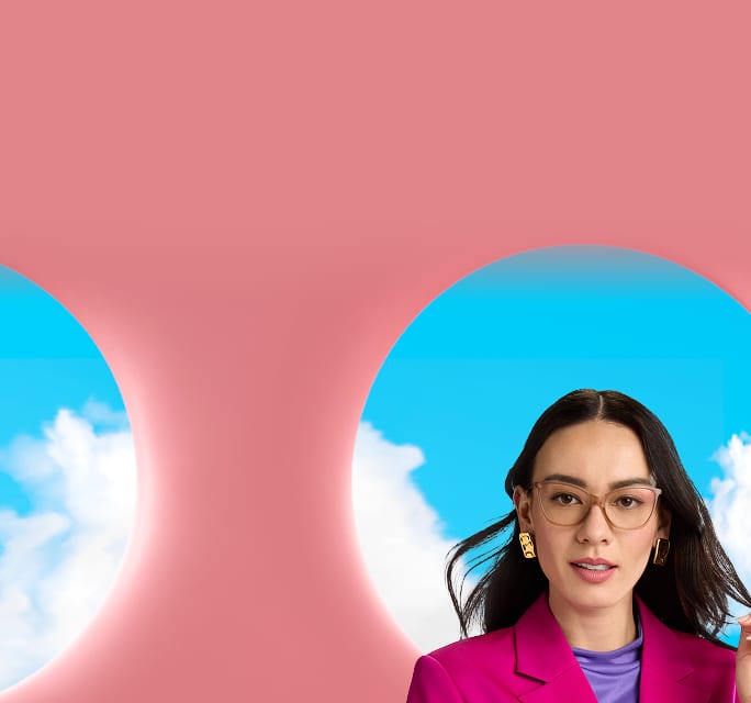 Woman in a magenta blazer wearing Zenni pink cat-eye, set against pink arches and a blue sky.