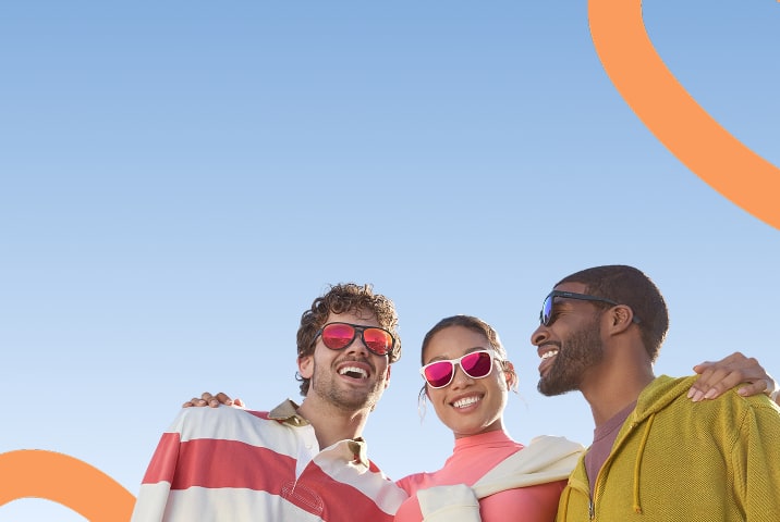A young woman and two young men wearing sporty Zenni sunglasses with mirror lenses. Blue sky background.