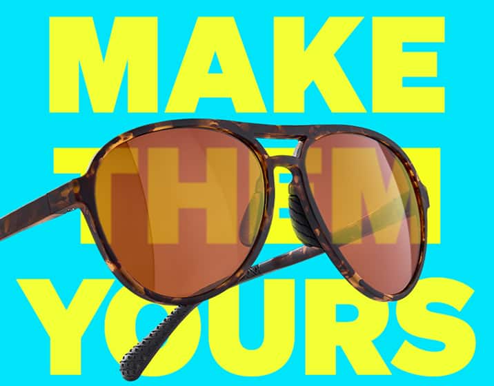 Close-up of brown aviator Zunnies Active Style sunglasses with orange tinted lenses against a blue background with yellow text “Make Them Yours.”