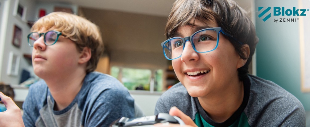 Image of two teenagers wearing zenni blokz glasses while playing a video game.