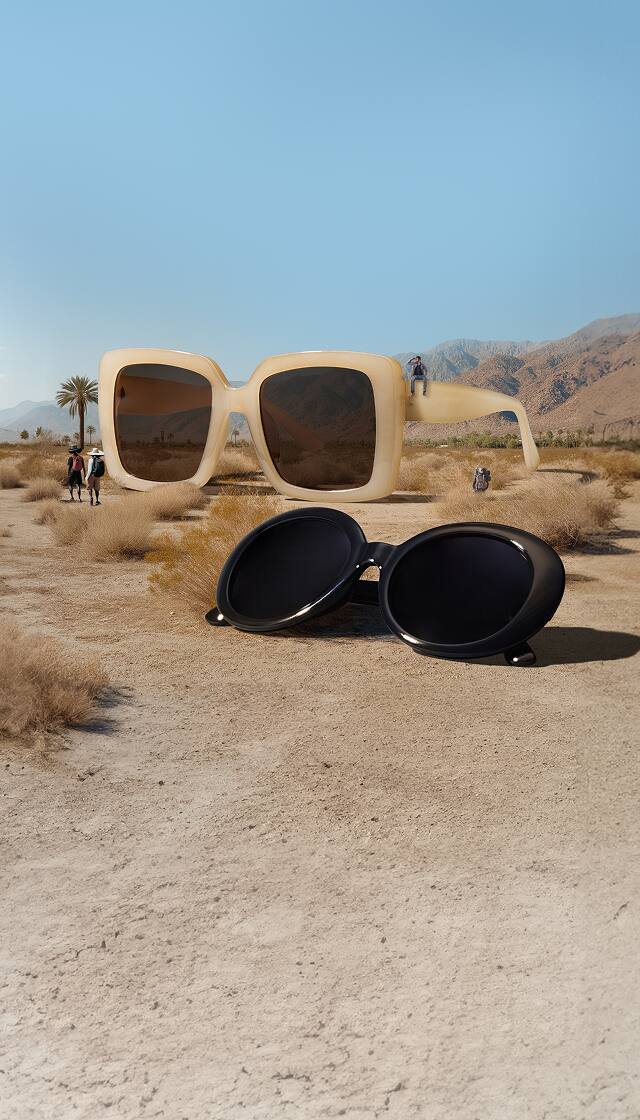 Surreal desert scene with giant sunglasses and tiny people. Style no. T01431515, 2023021.