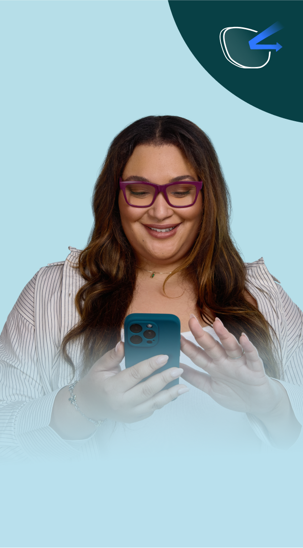 A smiling woman with long brown hair and purple glasses is looking at her phone. She is wearing a light striped shirt and standing against a light blue background. In the upper-left corner, there is a dark green semi-circle with a white eyeglass icon and a blue arrow, possibly indicating blue light filtering technology.