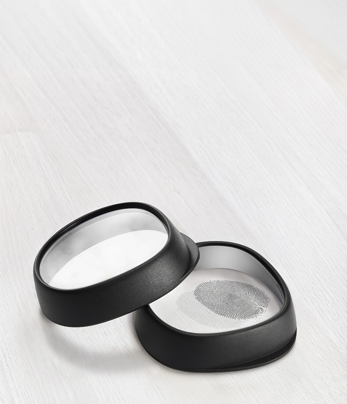 Two Zenni VR lens inserts with black frames, one showing a fingerprint to illustrate anti-fog and oil-resistant coatings.