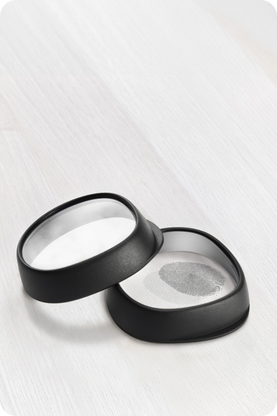 Two Zenni VR lens inserts with black frames, one showing a fingerprint to illustrate anti-fog and oil-resistant coatings.