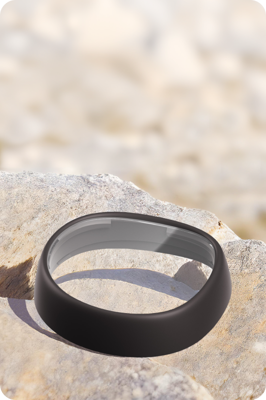 Zenni VR lens insert with scratch-resistant coating resting on a rock, highlighting durability against scratches and abrasions.