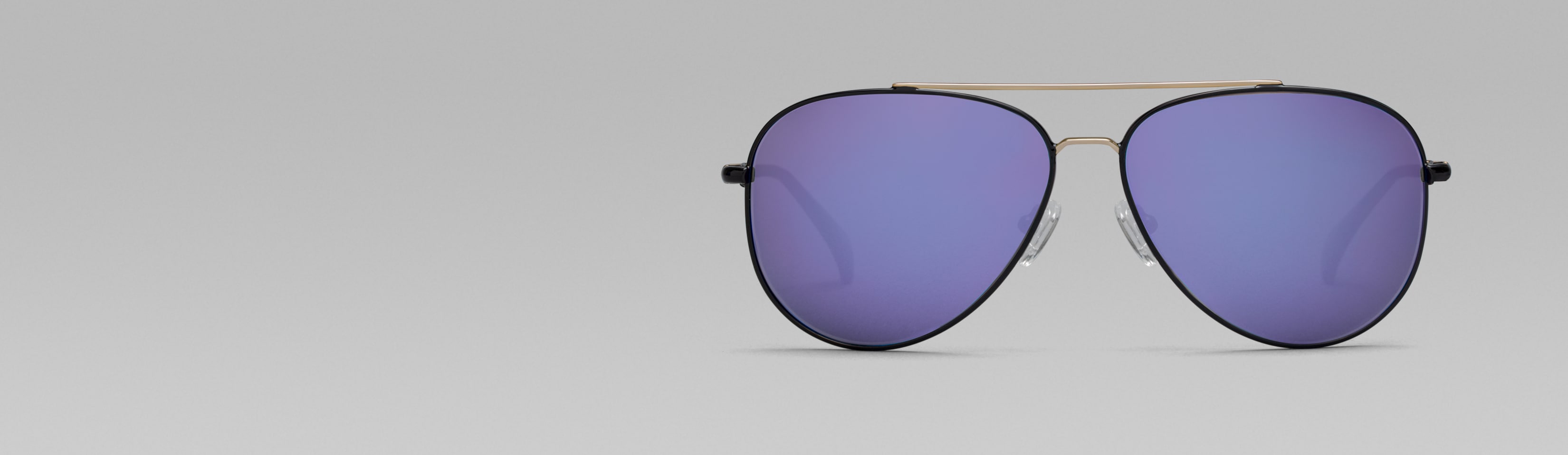 Rotating image of Zenni Premium Aviator Sunglasses #1126721 in black with tinted lens (yellow and lavender tint) and mirror coating options (indigo blue, moss green, and lavender mirror).
